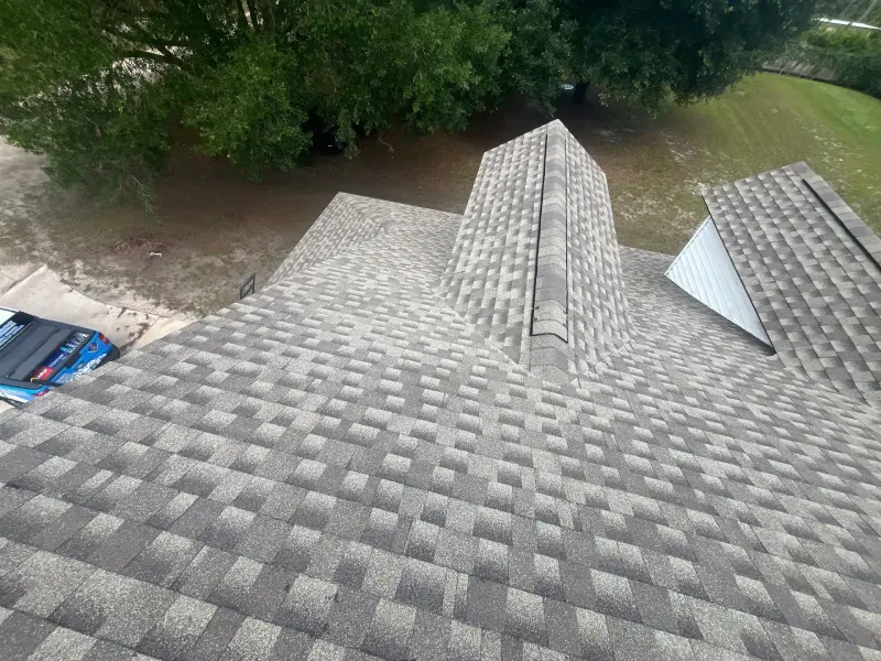 Aerial view of completed shingle roof with ridge cap — Jacksonville, FL