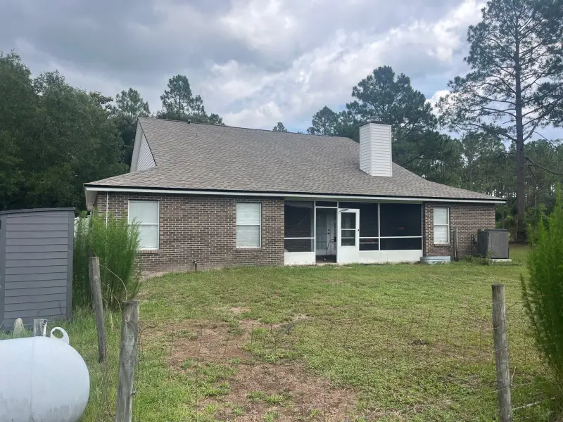 Completed architectural shingle roof on a Jacksonville brick home — Bigfoot Roofing